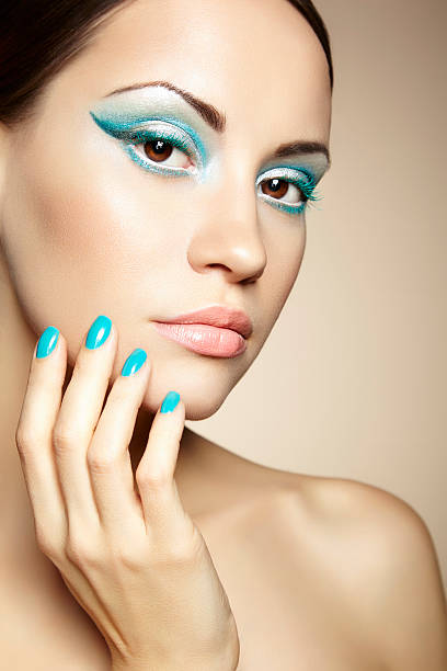 istock Beautiful young woman with bright make-up and manicure 506693263