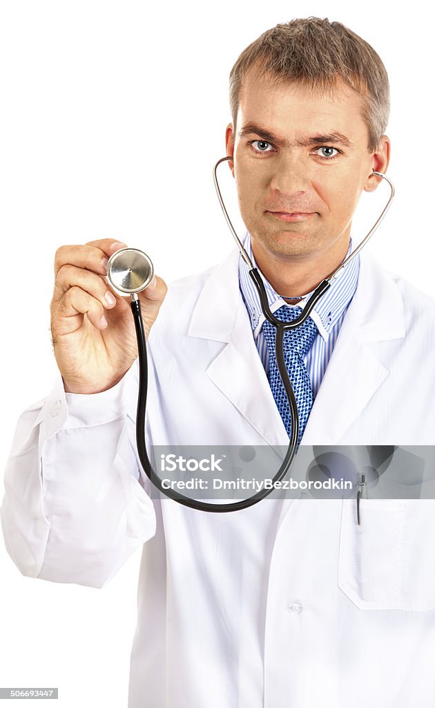 Male doctor holding a stethoscope. Male doctor holding a stethoscope. Isolated on white background Adult Stock Photo