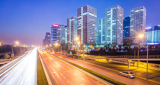 istock light trails on the modern city at dusk 506694273