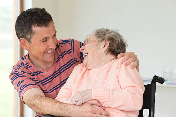 Home Caregiver Portrait of senior woman and her carer. father daughter 80s stock pictures, royalty-free photos & images