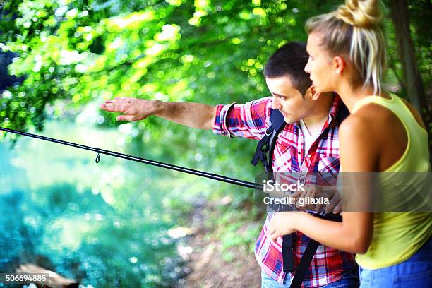 Fishing Lesson Stock Photo - Download Image Now - Couple - Relationship, Fishing, Summer