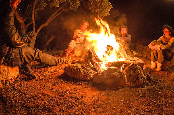 istock Campfire of friends in circle on the fire 506695981