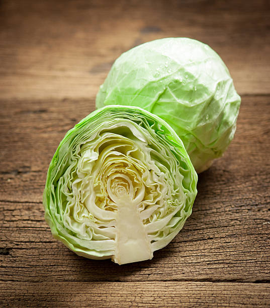 istock cabbage and cutted cabbage on wooden 506699174