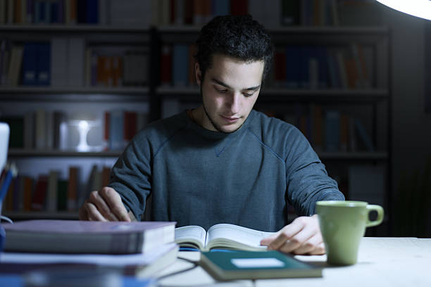 istock Teenager studying late at night 506700402