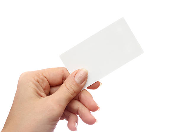 istock Female hand holds business card on white background 506705424