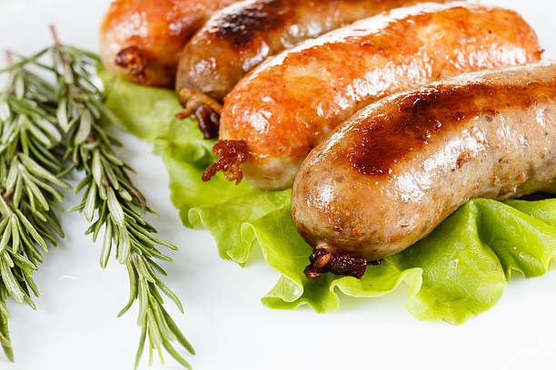 istock Roast beef or chicken sausage on a plate 506705436