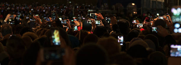 istock People holding their smart phones 506706748