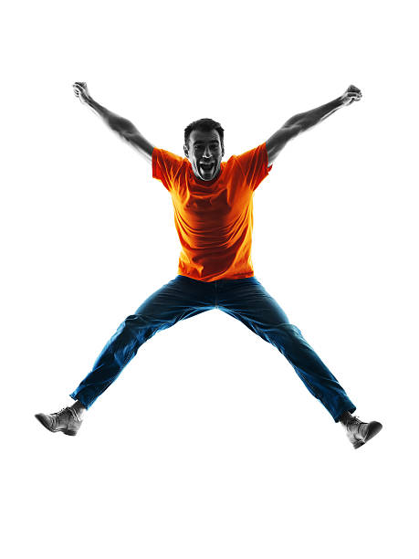 istock man jumping happy silhouette isolated 506709468