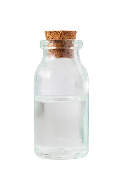 istock clear color old Apothecary Bottle isolate on white background 506711256