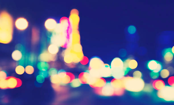 istock Retro toned blurred street lights, urban abstract background. 506711746