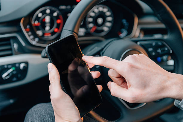 istock Driver using smart phone in luxury car, calling road assistance 506712086