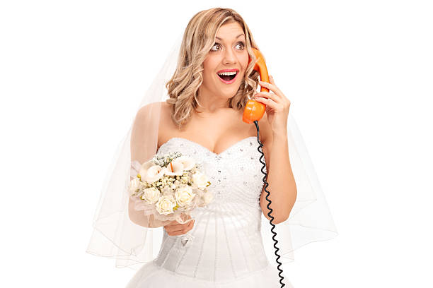 istock Cheerful bride talking on telephone 506712468