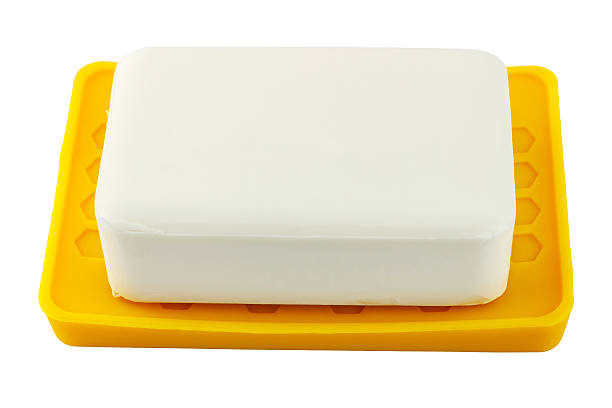 istock White soap on yellow holder isolated on white background 506712742