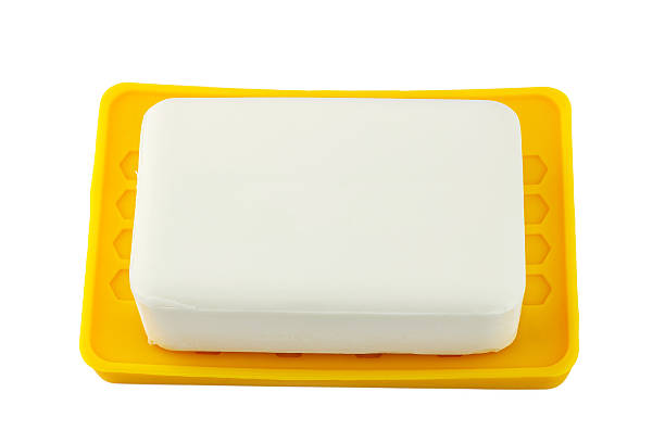istock White soap on yellow holder isolated on white background 506712782