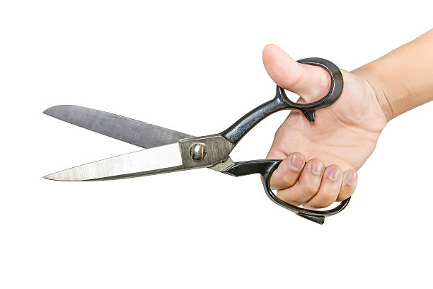 istock Hand holding big steel scissors 506713177