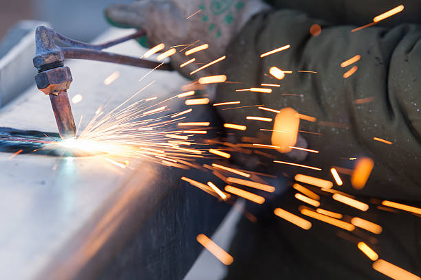 istock worker cutting steel pipe using metal torch and install roadside 506714185