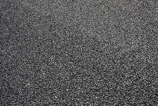 istock close-up horizontal view of new asphalt road 506714671