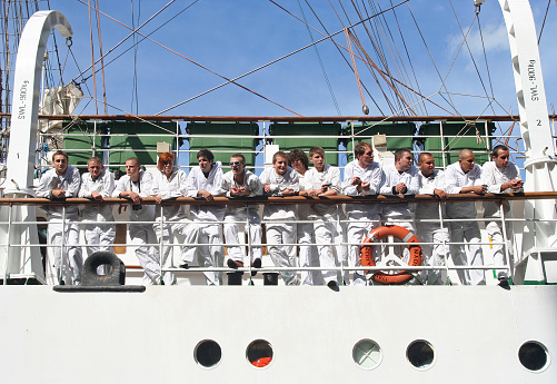 Amsterdam, Holland - August 19, 2010: Sailors on the Polish ship Dar Mlodziezy at Sail 2010 in Amsterdam, Holland on august 19, 2010