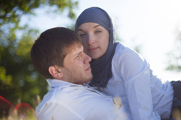istock Romantic young couple relaxing outdoors in park 506715397