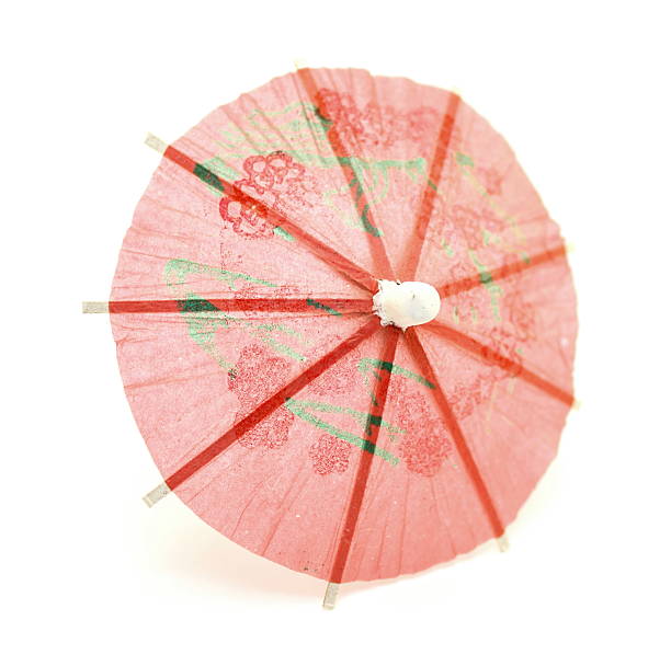 istock Pink cocktail umbrella 506715399