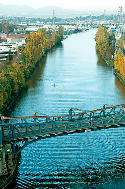 istock People rowing boats down Ship Canal toward drawbridge in Seattle 506717173