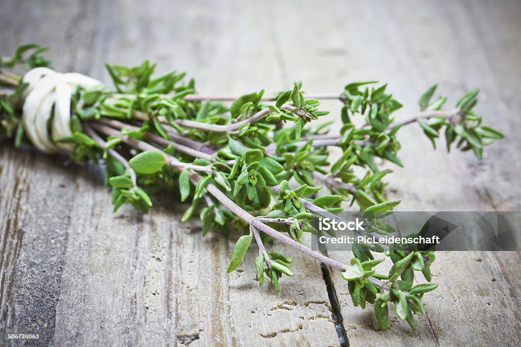 thyme on wooden table fresh thyme on wooden table Thyme Stock Photo