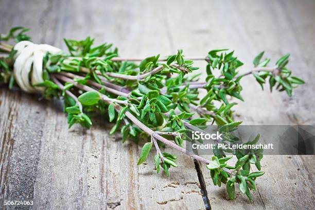Thyme On Wooden Table Stock Photo - Download Image Now - Thyme, Bunch, Table