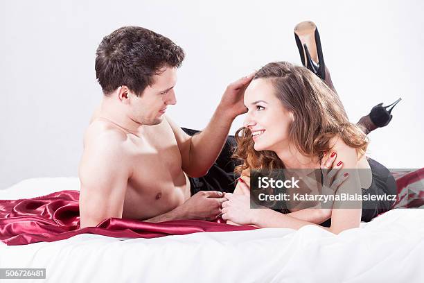 Couple Lying On Bed Stock Photo - Download Image Now - Adult, Adults Only, Beautiful People