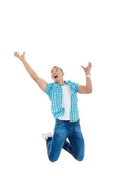 istock man jumps in air with his hands up 506727859