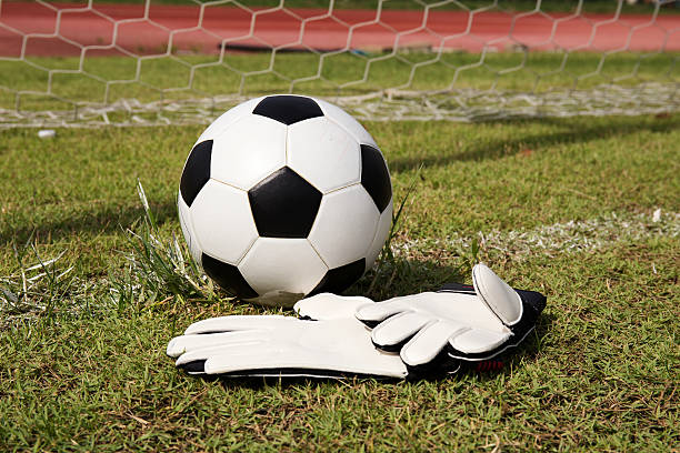 istock Gloves and soccer ball 506728697