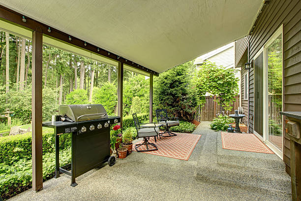 istock Covered walkout deck with barbecue and iron chairs 506728757