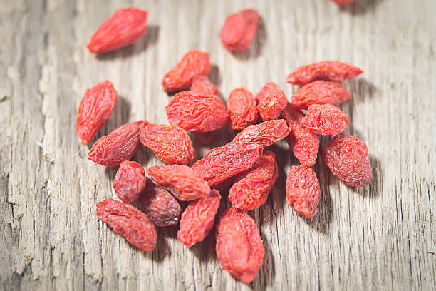 istock Goji berries in wooden background 506728815