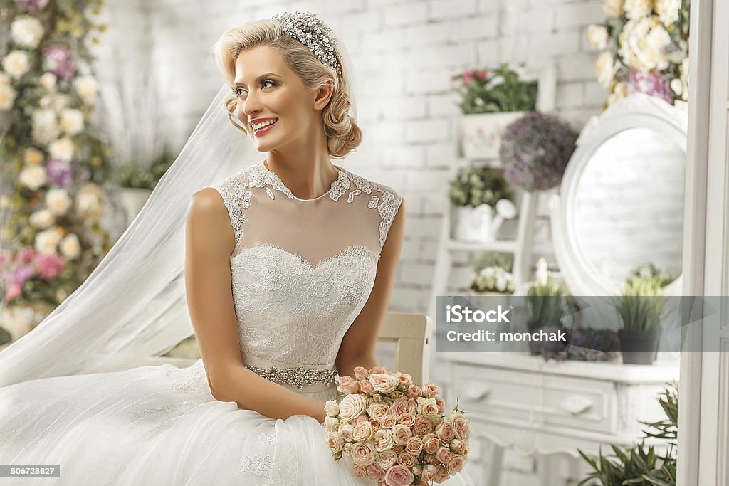 The beautiful  woman posing in a wedding dress Bride Stock Photo
