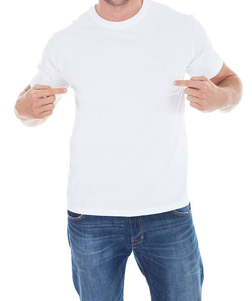 istock Man pointing at his blank white t-shirt 506729351