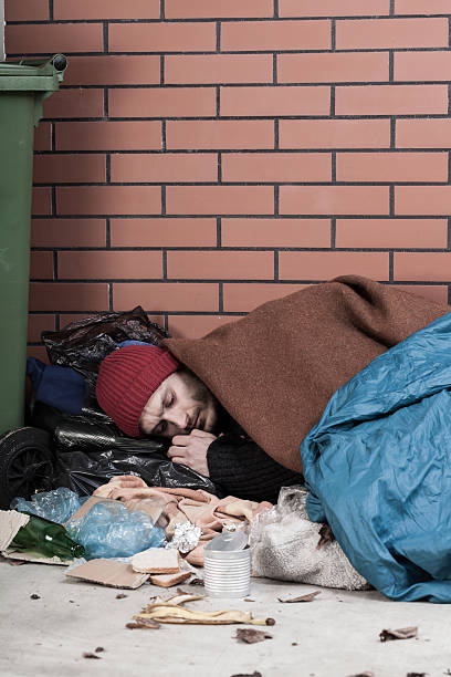 istock Homeless resting on the pavement 506731301