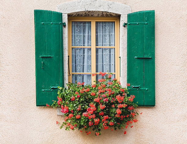 istock Vintage window with flowers and shutters in  Switzerland 506754032