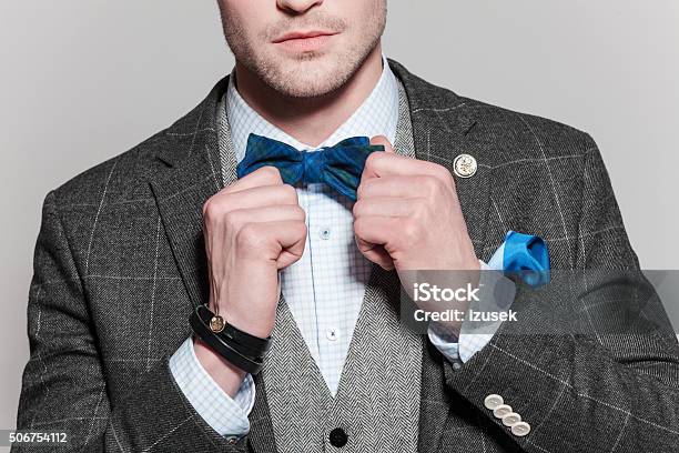 Classical Elegance Man Wearing Tweed Jacket And Bow Tie Stock Photo - Download Image Now