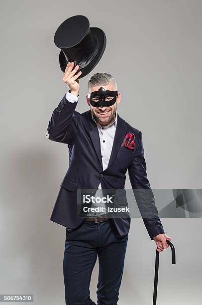 Wizard Elegant Bearded Man Wearing Top Hat And Carnival Mask Stock Photo - Download Image Now