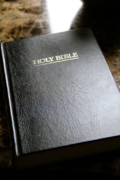 istock Holy Bible Resting on Marble Slab 506757613