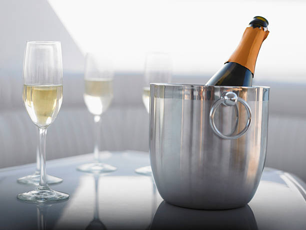 istock Flutes With Champagne Bottle In Ice Bucket 506758271