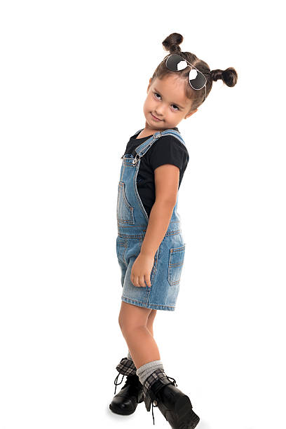 istock Baby girl  with sunglasses posing  in studio.Isolated 506758810