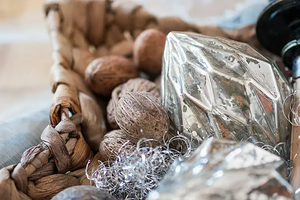 Wicker basket with nuts and silver Christmas balls