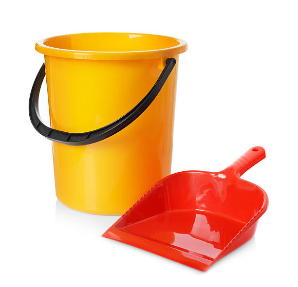 istock Yellow bucket and red scoop isolated on white background 506760114