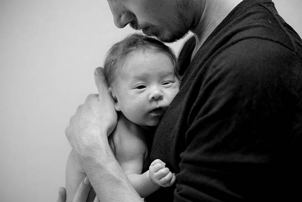 istock Dad with newborn baby 506760452