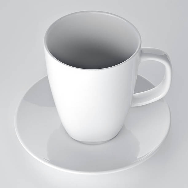 istock White cup with seucer isolated on gray background 506760516