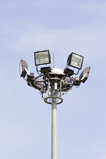 istock Stadium football game light pole in daytime. 506761461