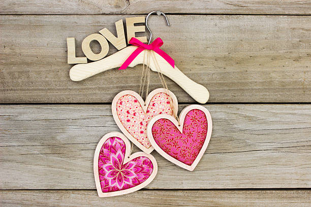 istock Hearts hanging on hanger with the word LOVE 506762246