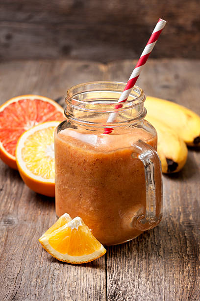 istock smoothies with orange, grapefruit  and banana 506762938