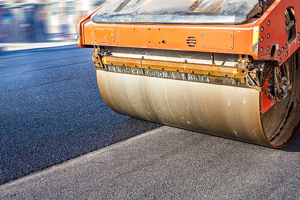 Heavy Vibration roller at asphalt pavement works Heavy Vibration roller at asphalt pavement works compactor photos stock pictures, royalty-free photos & images