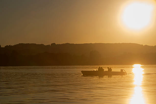 istock Motor boat, sunset at the lake 506764844